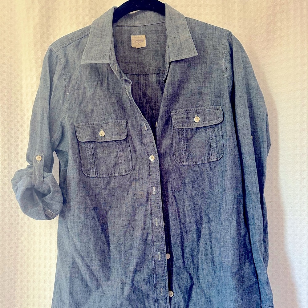 Blue cotton w white stitching button up. Sleeves can be rolled + buttoned up.